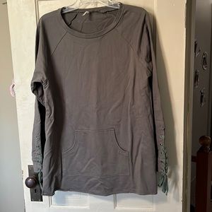 Tunic length (30”) top with kangaroo pocket and fun details on the sleeve